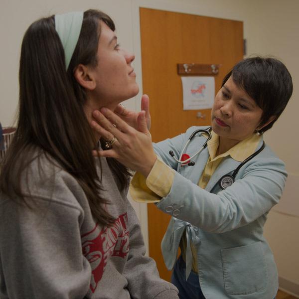 student getting checked out at the wellness center